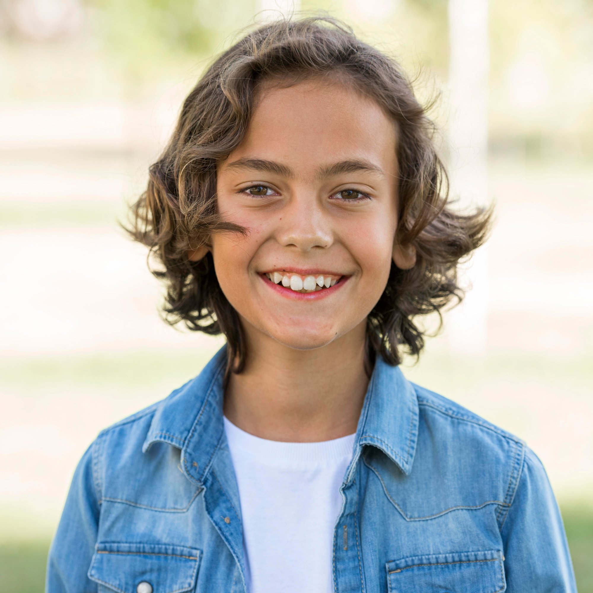 smiley-boy-posing-while-out-park